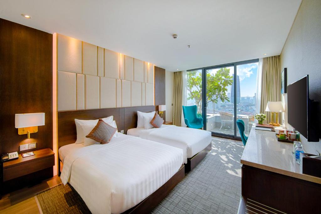 Phòng ngủ tại khách sạn New Orient Hotel Đà Nẵng
